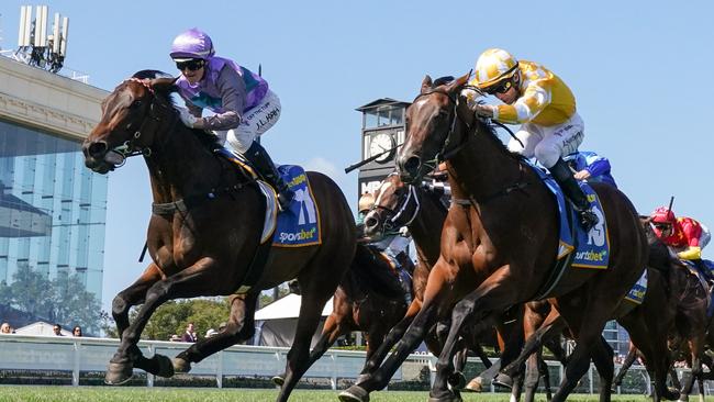 Hayasugi (left) runs down Lady Of Camelot. Picture: Scott Barbour/Racing Photos via Getty Images