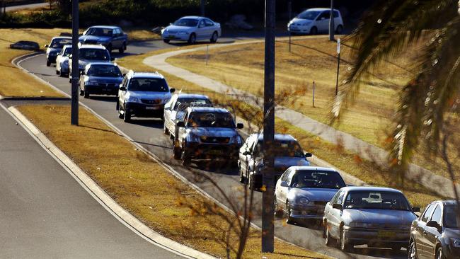 Traffic backs up on Glenmore Parkway for drivers wanting to turn onto Mulgoa Rd.