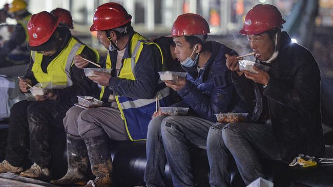 Construction workers have been working around the clock to construct a temporary field hospital in Wuhan. Picture: Chinatopix/AP