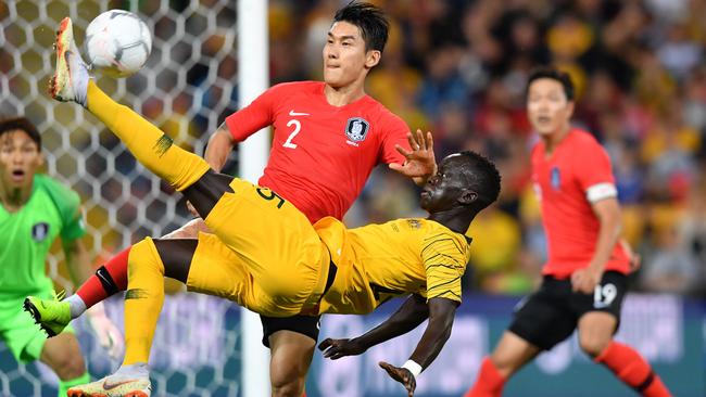 Former Adelaide United winger Awer Mabil attempts an overhead kick as Korea Republic’s Lee Yong looks on at Suncorp Stadium last year. Picture: AAP Image/Darren England