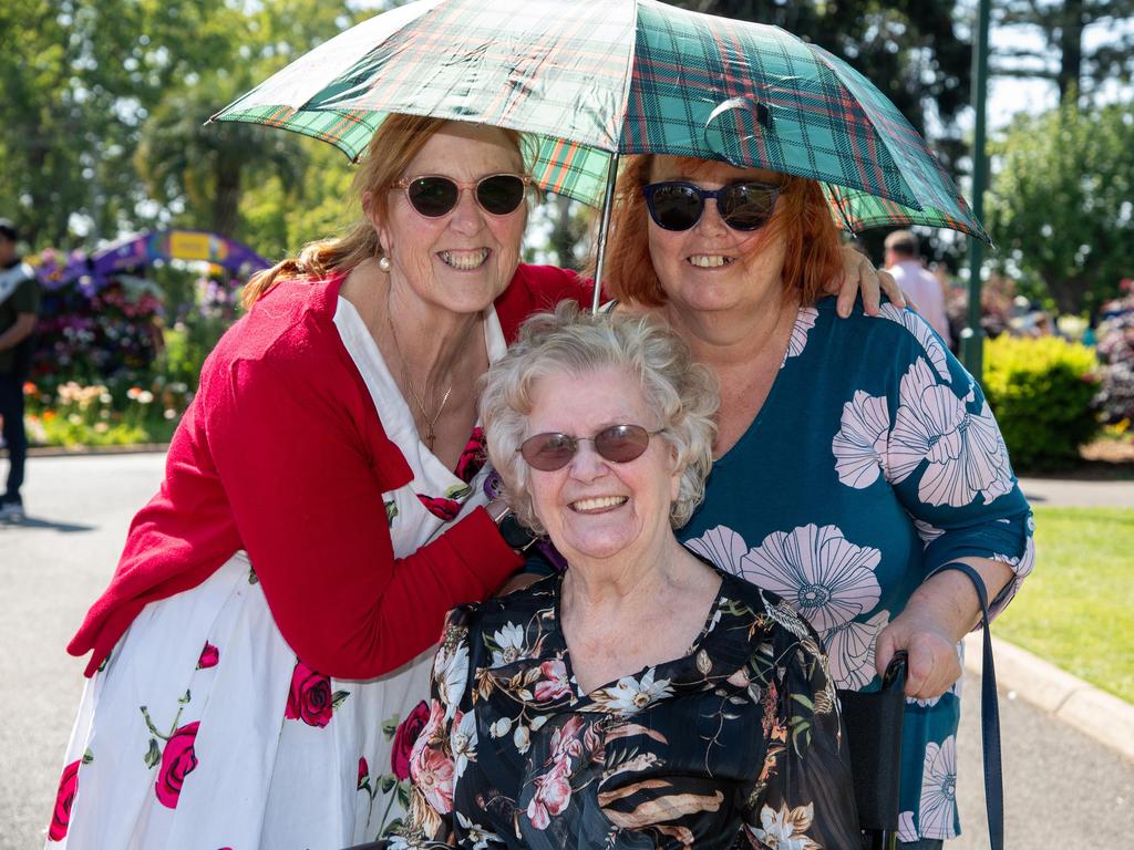 Colleen Trewavas (left), Margaret Howie (seated) and Natasha Gribben in the Botanic Gardens, Queens Park during the Carnival of Flowers, Sunday, September 22, 2024. Picture: Bev Lacey