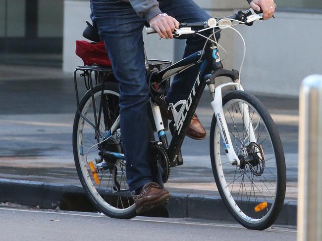 Embargoed For Saturday Telegraph 15th June 2019. Very few cyclists wear a helmet in Manly. People risking fines for riding on pedestrian crossings when they are supposed to dismount, on footpaths and in prohibited areas like Manly Wharf (It is unknown if the Corso has any restrictions) and  going through red lights. Picture: John Grainger