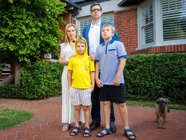 Ben and Kat Mansfield, with, Henry, 7 and Charlie, 10. Henry is too scared to sleep in his own bed after the home invasion. Picture: Mark Stewart