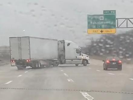 A woman caught the terrifying moment a semi-truck slid across multiple lanes of traffic and jackknifed on a highway in Kansas City, Missouri, on Saturday, January 4, as a major winter storm moved through the region. Credit: Gracie Fudge via Storyful