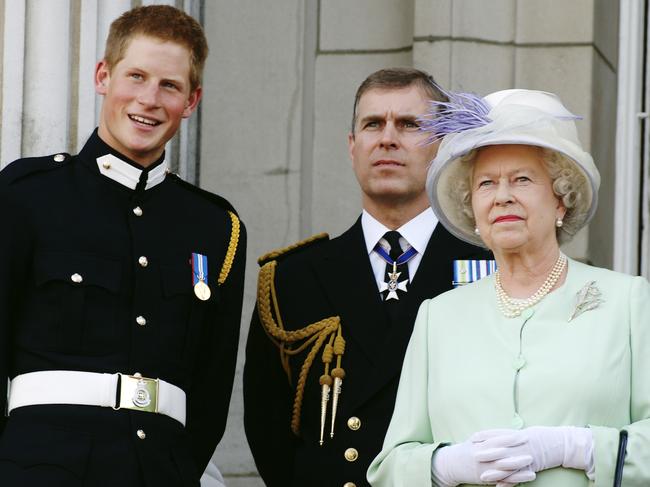 Prince Andrew with Prince Harry and the Queen at Buckingham Palace in 2005. Picture: Getty Images