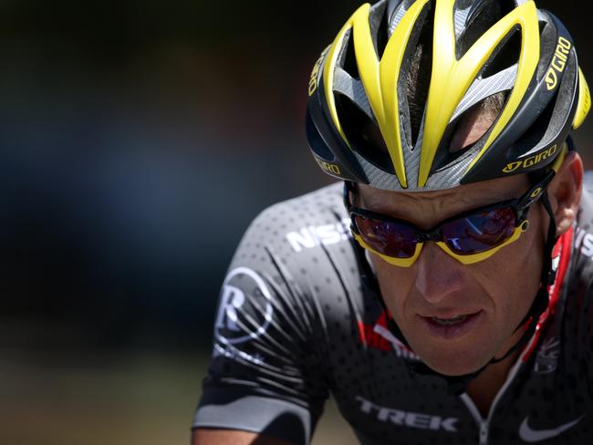 Cyclist Lance Armstrong on a short ride to stretch his legs after arriving for the Tour Down Under in Adelaide, South Australia.