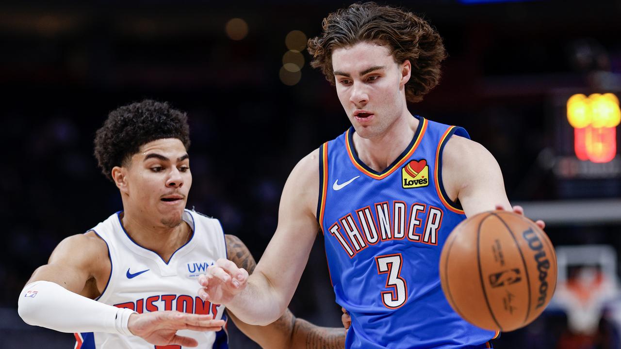 DETROIT, MICHIGAN - JANUARY 28: Josh Giddey #3 of the Oklahoma City Thunder dribbles the ball against Killian Hayes #7 of the Detroit Pistons in the first quarter of a game at Little Caesars Arena on January 28, 2024 in Detroit, Michigan. NOTE TO USER: User expressly acknowledges and agrees that, by downloading and or using this photograph, User is consenting to the terms and conditions of the Getty Images License Agreement. (Photo by Mike Mulholland/Getty Images)