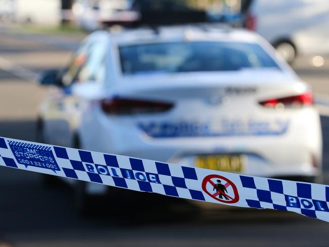 SYDNEY, AUSTRALIA - NEWSWIRE PHOTOS June 14 2022: A general stock image of a Police tape in front of a Police car in Sydney. Picture NCA Newswire/ Gaye Gerard.