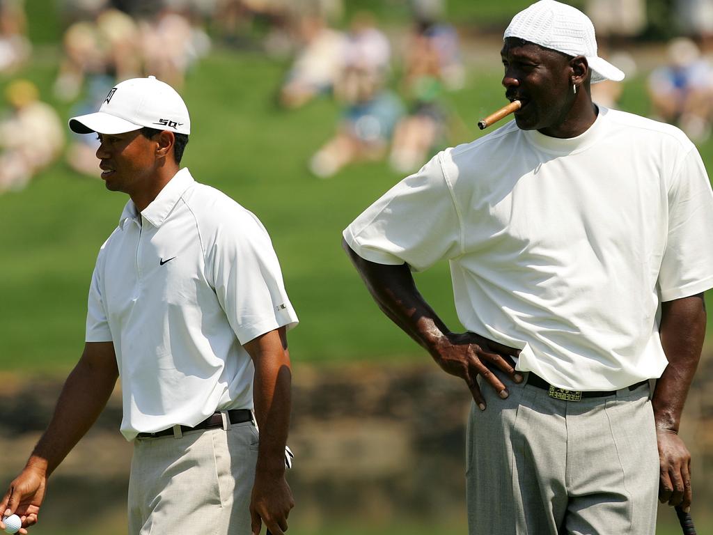 Michael Jordan (R) with fellow Nike athlete Tiger Woods (L) is famous for betting big sums on the golf course.