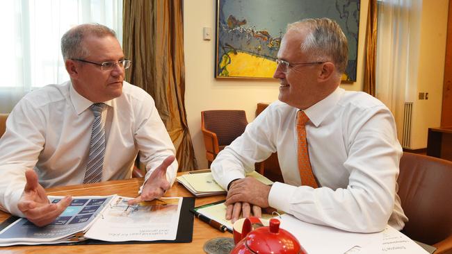 Treasurer Scott Morrison and Prime Minister Malcolm Turnbull looking at the Budget Papers. Picture: AAP Image/Mick Tsikas