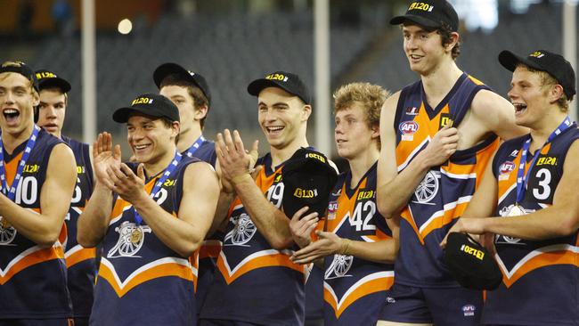 Victorious Calder Cannons players celebrate their grand final win.