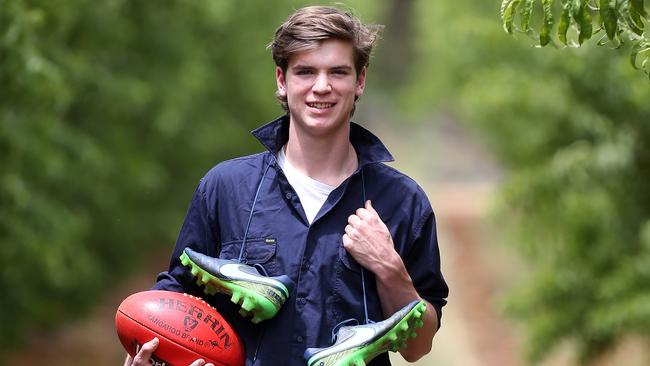 Paddy Dow poses on the family farm before the AFL draft in 2017. Picture: Yuri Kouzmin.