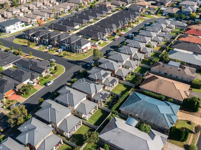 Aerial view of rows of mass produced 'cookie cutter' style homes build during the 2010s in outer suburban Sydney, Australia.