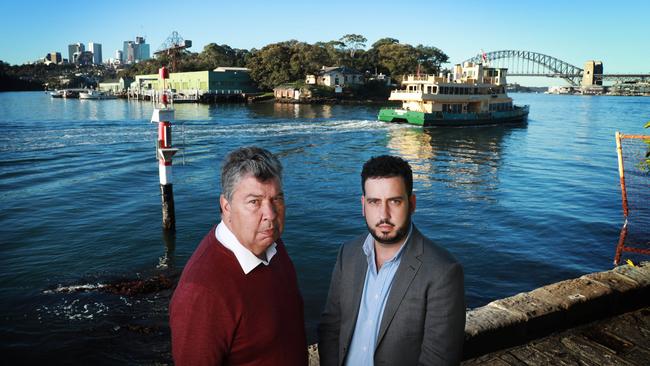 Ash Walker, right, and his father Lloyd Walker at Simmons Point Reserve in Sydney’s inner-city Balmain East, with Goat Island behind them. Picture: John Feder