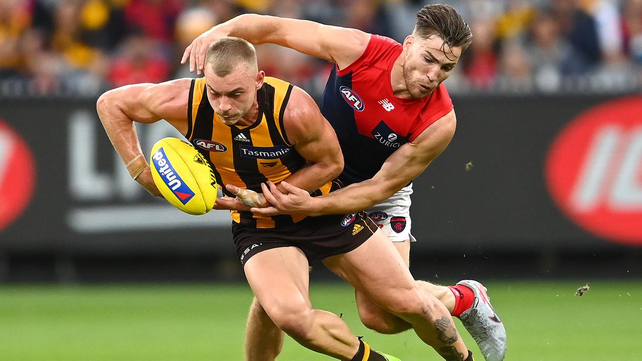MELBOURNE, AUSTRALIA - APRIL 18: James Worpel of the Hawks is tackled by Jack Viney of the Demons during the round five AFL match between the Hawthorn Hawks and the Melbourne Demons at Melbourne Cricket Ground on April 18, 2021 in Melbourne, Australia. (Photo by Quinn Rooney/Getty Images)