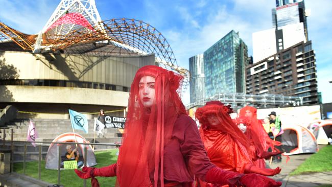 Red-robed figures known as the ‘Red Rebel Brigade’ are a common feature at climate protests. Picture: NCA NewsWire / Nicki Connolly