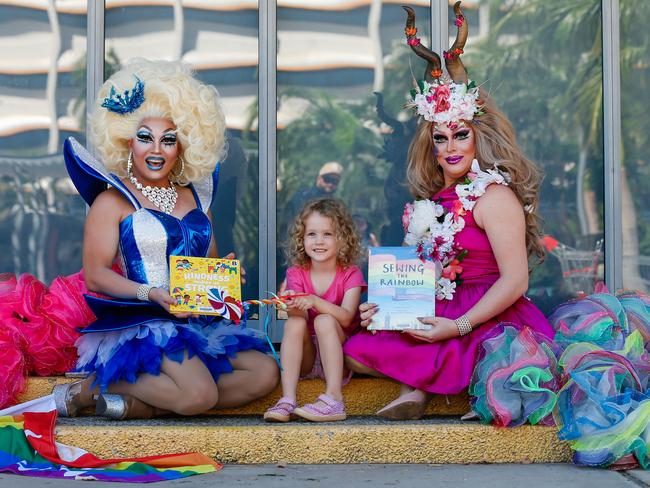 Ferocia Coutura and Vogue MegaQueen with four-year-old Lily for Drag Queen Storytime. Picture: Glenn Campbell