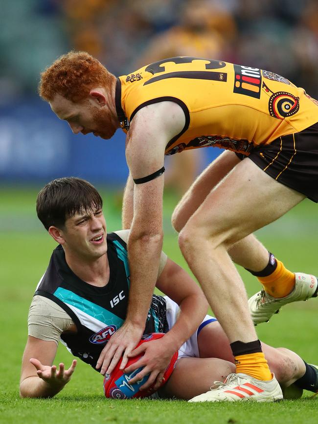 Zak Butters scraps with Hawthorn’s Conor Glass. Picture: Scott Barbour/Getty Images