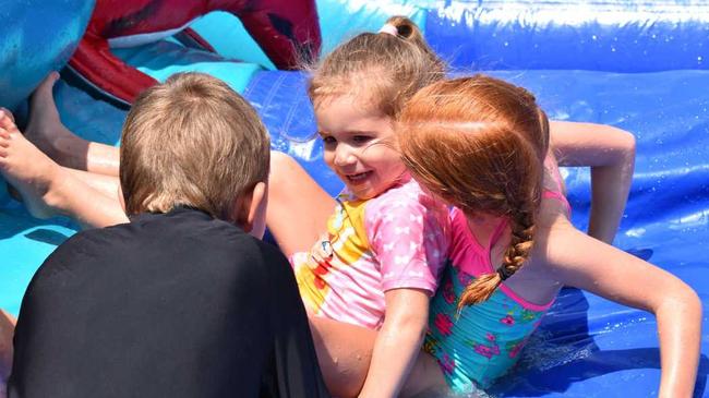 Aleah, 3, and Harra Brown from Woolgoolga were surprised with a trip to the Yamba Bowlo Water Slide Day. Picture: Jenna Thompson