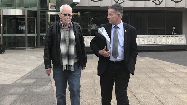 Support After Murder president Peter Rolfe and victim’s advocate Howard Brown leaving the public parole hearing on Friday.