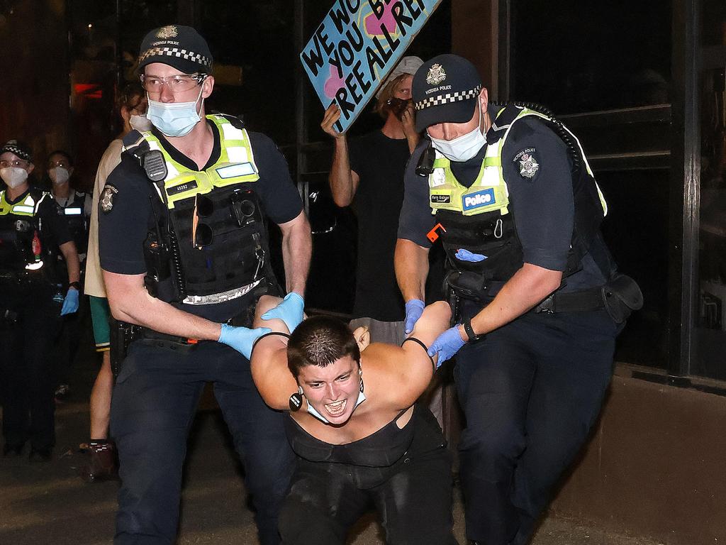 A protestor is taken away by police. Picture: Ian Currie