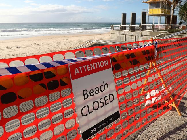 GOLD COAST, AUSTRALIA - APRIL 08:  Beach Closed at Surfers Paradise beach on April 08, 2020 in Gold Coast, Australia. A number of major Gold Coast beaches have been closed over COVID-19 concerns. Gold Coast Mayor Tom Tate announced The Spit, Surfers Paradise and Coolangatta beaches would be closed ahead of the Easter long weekend to avoid people travelling to the area. Other beaches will remain open to Gold Coast residents only. The Australian government has introduced further restrictions on movement and gatherings in response to the ongoing COVID-19 pandemic. Public gatherings are now limited to two people, while Australians are being urged to stay home unless absolutely necessary. New South Wales and Victoria have also enacted additional measures to allow police the power to fine people who breach the two-person outdoor gathering limit or leave their homes without a reasonable excuse. Queensland, Western Australia, South Australia, Tasmania and the Northern Territory have all closed their borders to non-essential travellers and international arrivals into Australia are being sent to mandatory quarantine in hotels for 14 days. (Photo by Chris Hyde/Getty Images)