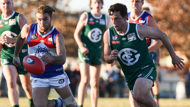 North Heidelberg's Jesse Tardio and Greensborough's Nathan Hrovat keep their eye on the ball. Picture: Nathan McNeill