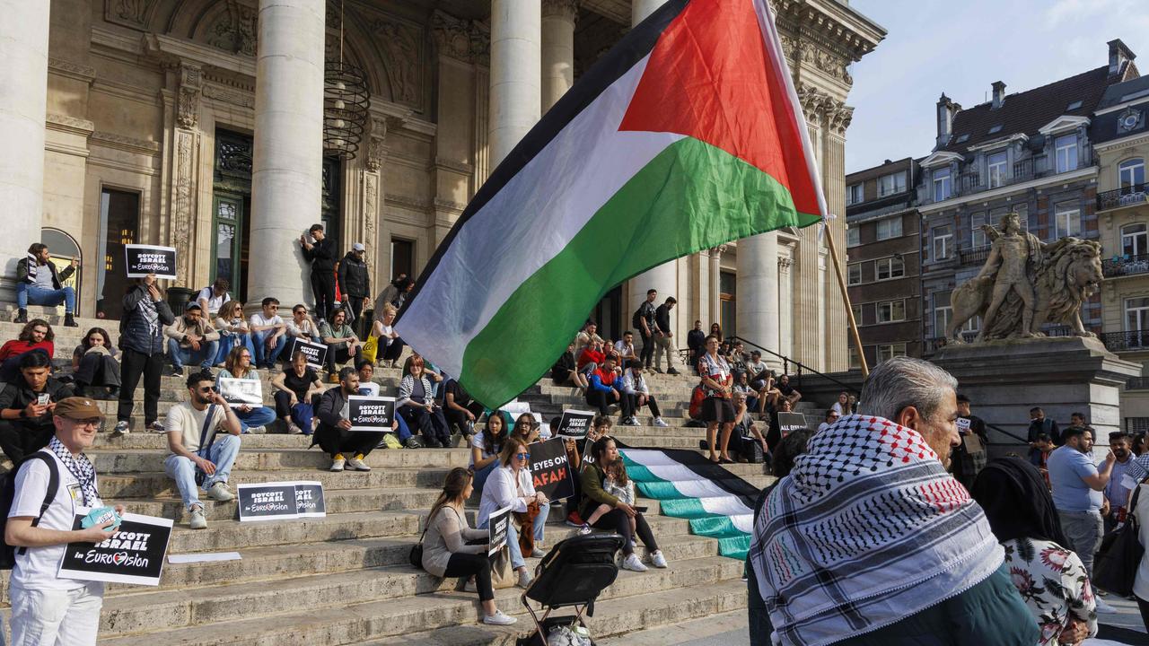 A protester holds a Palestinian flag during a demonstration in support of Palestinian people and calling for a ceasefire in Brussels. Picture: AFP