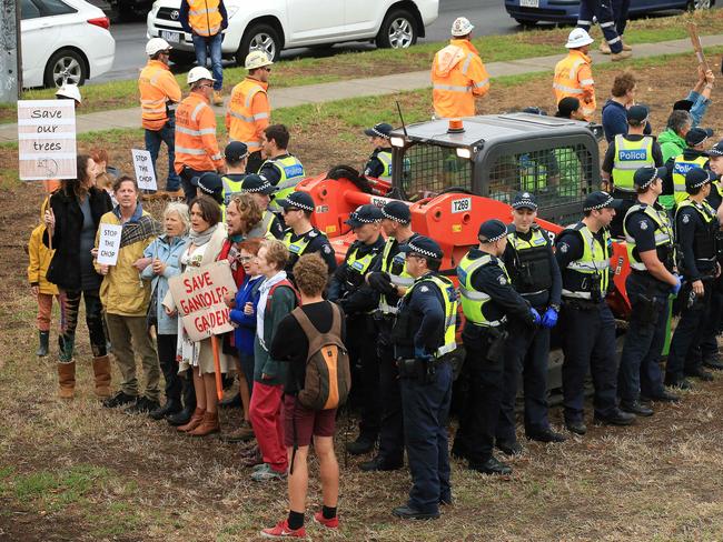 The protesters formed a human shield around a forklift. Picture: Mark Stewart