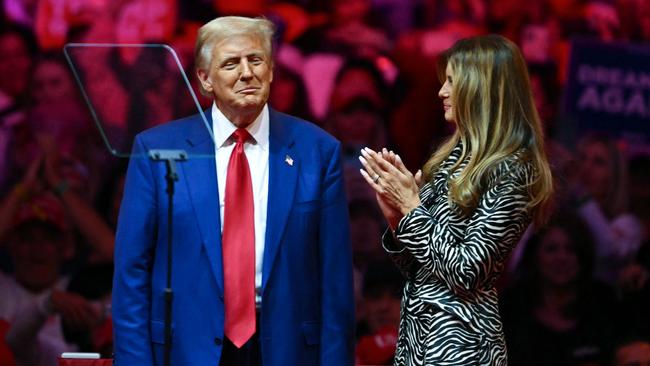 TOPSHOT - Former US First Lady Melania Trump applauds her husband former US President and Republican presidential candidate Donald Trump after he spoke at a campaign rally at Madison Square Garden in New York, October 27, 2024. (Photo by ANGELA WEISS / AFP)