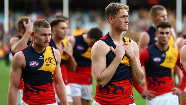 MELBOURNE, AUSTRALIA – JUNE 01: Brayden Cook and his Crows' teammates look dejected after losing the round 12 AFL match between Hawthorn Hawks and Adelaide Crows at Melbourne Cricket Ground, on June 01, 2024, in Melbourne, Australia. (Photo by Quinn Rooney/Getty Images)