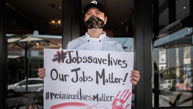 A chef at the Rocket restaurant in Parkhurst, Johannesburg, protests against South Africa’s national lockdown regulations. Picture: AFP