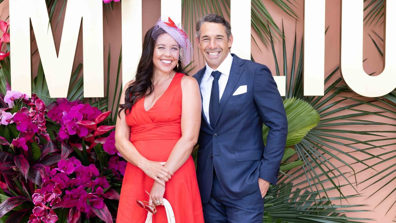 Nicole and Billy Slater at the Magic Millions race day - before the heavens opened up. Picture: Luke Marsden.