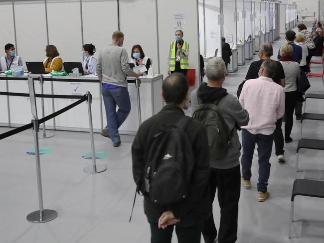 People register inside the centre. Monday, May 3, 2021. Picture: David Crosling