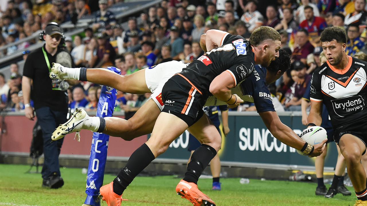 Murray Taulagi of the Cowboys offloads. Photo by Albert Perez/Getty Images