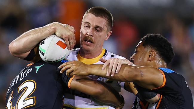 SYDNEY, AUSTRALIA - SEPTEMBER 06: Shaun Lane of the Eels is tackled during the round 27 NRL match between Wests Tigers and Parramatta Eels at Campbelltown Stadium, on September 06, 2024, in Sydney, Australia. (Photo by Jeremy Ng/Getty Images)