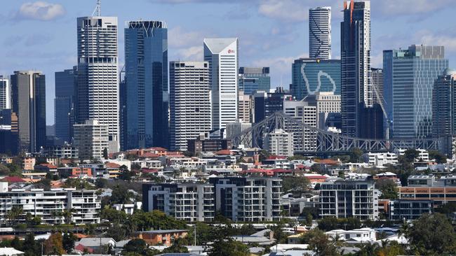 Houses and apartment buildings are seen against the Brisbane CBD skyline in Brisbane, Monday, August 27, 2018. According to property data company CoreLogic, Brisbane's median house price has risen 1.3 per cent over the past year, and is currently sitting at $538,693. (AAP Image/Darren England) NO ARCHIVING