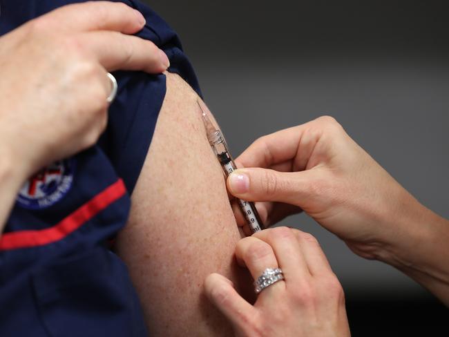 PERTH, AUSTRALIA - APRIL 20: Clinical nurse Wendy Dickinson receives a BCG injection in the trial clinic at Sir Charles Gairdner hospital on April 20, 2020 in Perth, Australia. Healthcare workers in Western Australia are participating in a new trial to test whether an existing tuberculosis vaccine can help reduce their chances of contracting COVID-19. 2000 frontline staff from Fiona Stanley, Sir Charles Gairdner and Perth Children's Hospital are taking part in the research trial, which will see half of participants receiving the existing Bacillus Calmette-GuÃ©rin (BCG) vaccine in addition to their flu vaccine, while the other half receive the regular flu shot. The BCG vaccine was originally developed to work against tuberculosis, but it is hoped it might help reduce the chance of contracting coronavirus as well as lessen the severity of symptoms and boost immunity in the long term. The BRACE trial is being led by by the Murdoch Children's Research Institute. (Photo by Paul Kane/Getty Images)