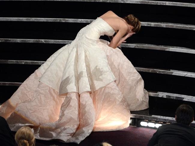 J Law took a trip ... up the stairs at the 2013 Oscars (at least her dressed saved the day). Picture: Getty Images