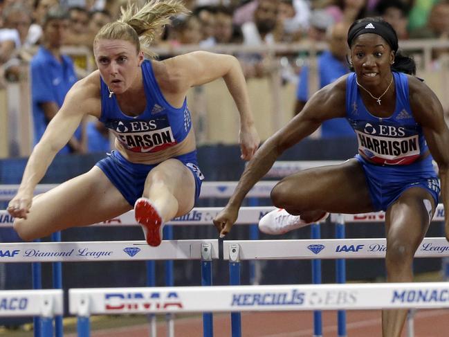 USA's Kendra Harrison, right, competes in the women' s 100m hurdles ahead of Sally Pearson during the IAAF Diamond League Athletics meeting at the Louis II Stadium in Monaco, Friday, July 21, 2017. (AP Photo/Claude Paris)