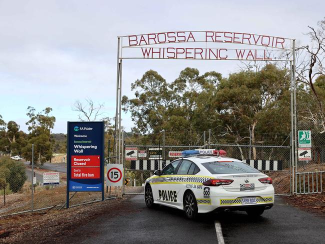 Police at the gate of the Whispering Wall following the tragedy. Picture: NCA NewsWire / Kelly Barnes