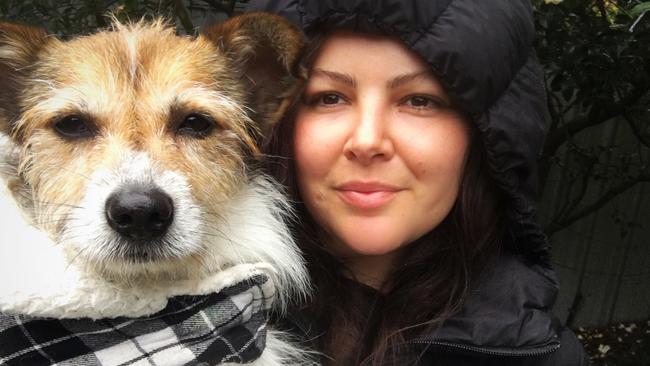 Alice Robson volunteers as Hunter Animal Rescue's pet photographer and social media co-ordinator. Pictured here with a foster dog Milo who has been rehomed. Supplied.