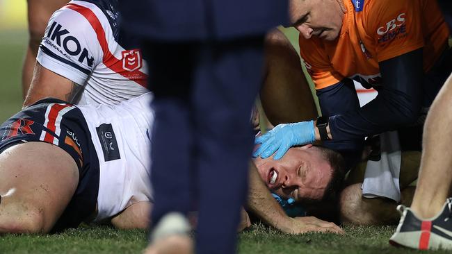 Lindsay Collins is attended to by trainers after a head clash against Manly. Picture: Cameron Spencer/Getty Images