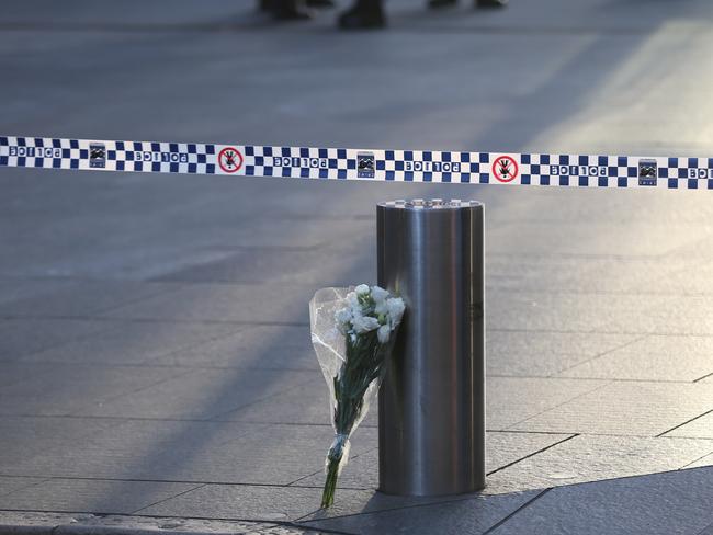 Flowers left at Martin Place this morning after the siege ended. Picture: John grainger