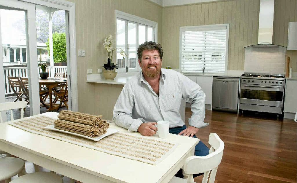 Dan Berigan relaxes in his fully renovated East Toowoomba home, on the market for $795,000. Picture: Nev Madsen