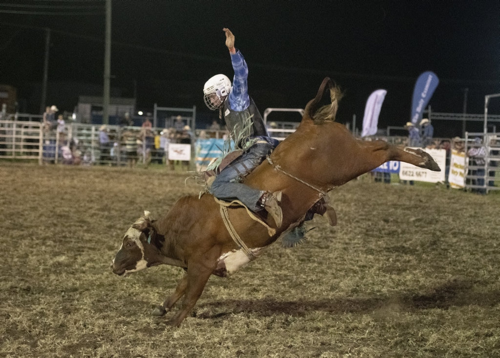 Big extension in the ride for Dan Ruhland in the junior bullride at the Lawrence Twilight Rodeo. Picture: Adam Hourigan