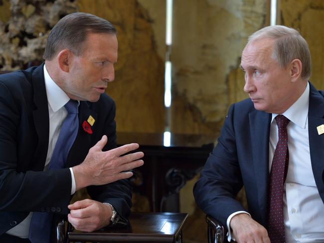 Mr Putin speaks with PM Abbott. Picture: Alexey Druzhinin