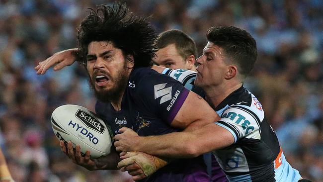 Melbourne Storm's Tohu Harris tackled by Cronulla Sharks Chad Townsend. .2016 NRL Grand Final match between Melbourne Storm and Cronulla Sharks at the ANZ Stadium Homebush, Sydney, Australia on October 2, 2016. Picture: Colleen Petch.