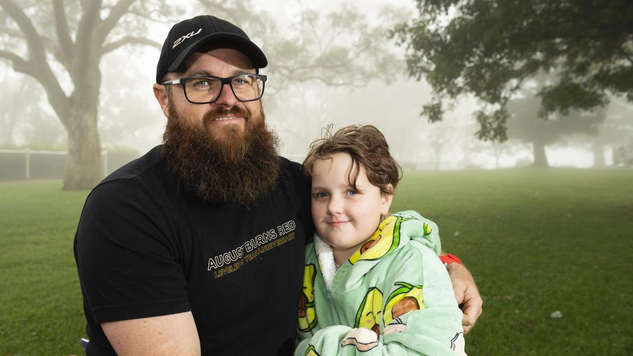Watching his wife, Kelly Crowther-Kerr, run is Tim Crowther and daughter Emma Crowther at Peak2Park 2022, Sunday, April 3, 2022. Picture: Kevin Farmer