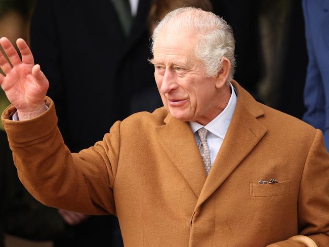 (FILES) Britain's King Charles III waves to wellwishers after attending the Royal Family's traditional Christmas Day service at St Mary Magdalene Church on the Sandringham Estate in eastern England on December 25, 2023. Britain's King Charles III admitted to hospital for prostrate surgery, Buckingham Palace said in a statement on January 26, 2024. (Photo by Adrian DENNIS / AFP)